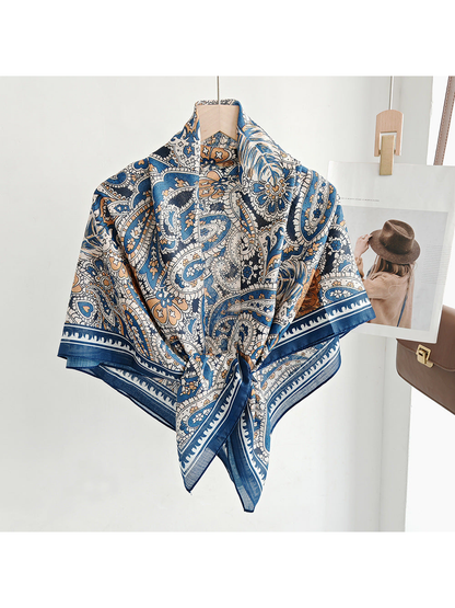 Blue, cream and brown paisley square scarf styled in a front knot