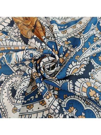 Close-up of the paisley scarf gathered to show its drape and surface texture