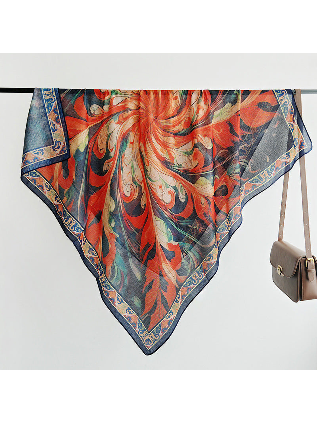 Multicolor square scarf spread over a display rail