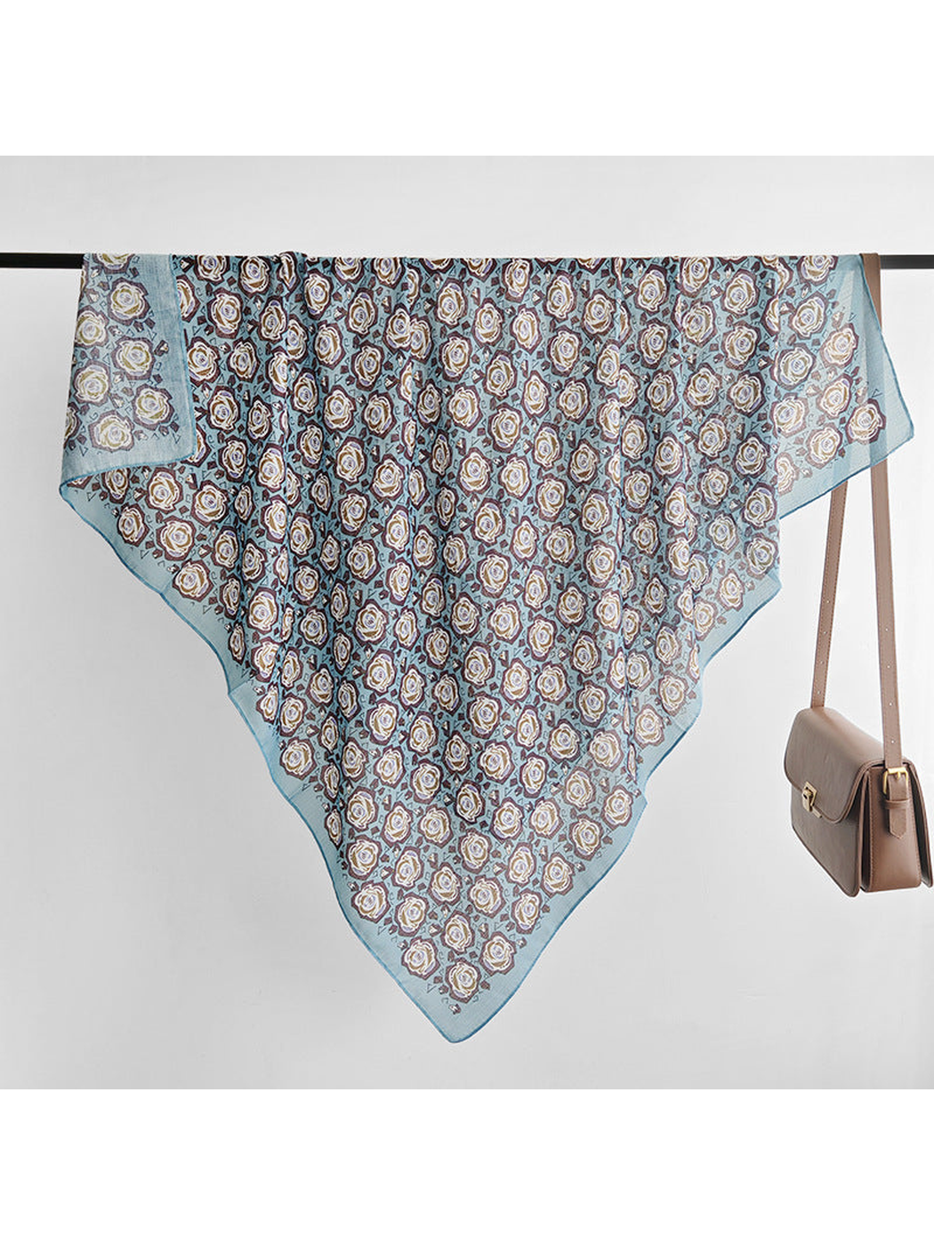 Light blue floral square scarf displayed diagonally