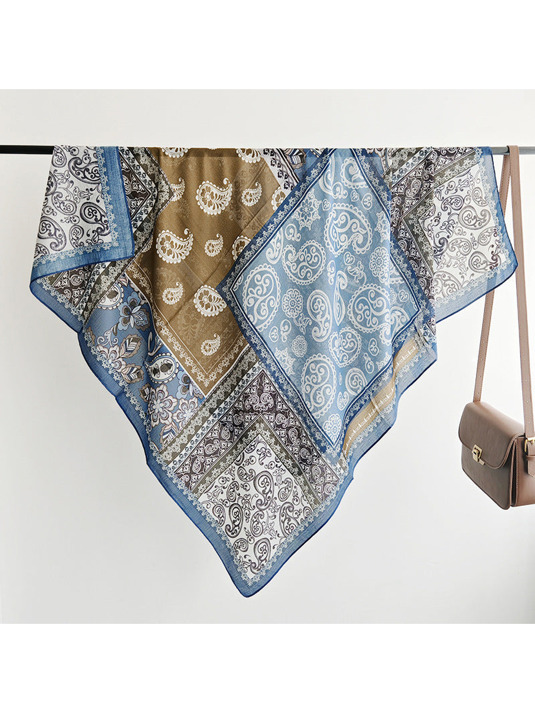 Multicolor square scarf draped to show the patchwork print