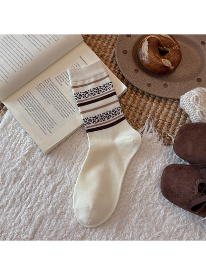 Ivory crew sock with brown stripes and leopard-pattern bands