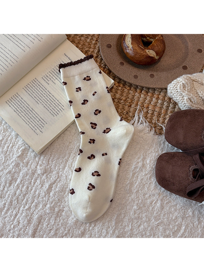 Ivory crew sock with allover brown leopard spots and scalloped cuff
