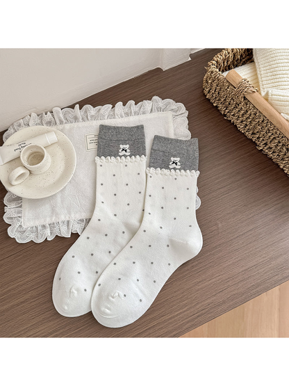 Dotted Bear ivory crew socks with gray cuffs and scalloped trim