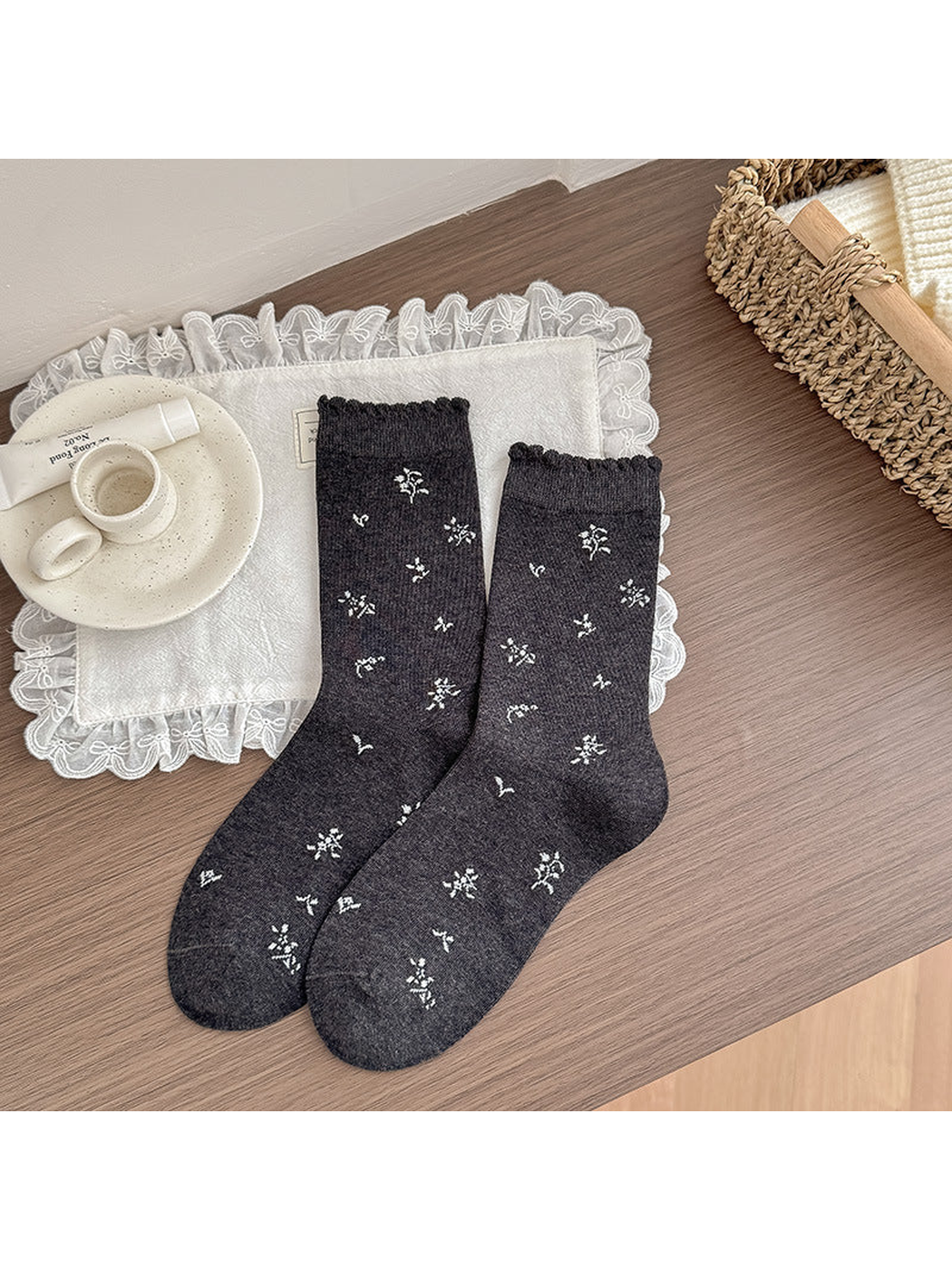 Floral dark gray crew socks with scattered white flowers