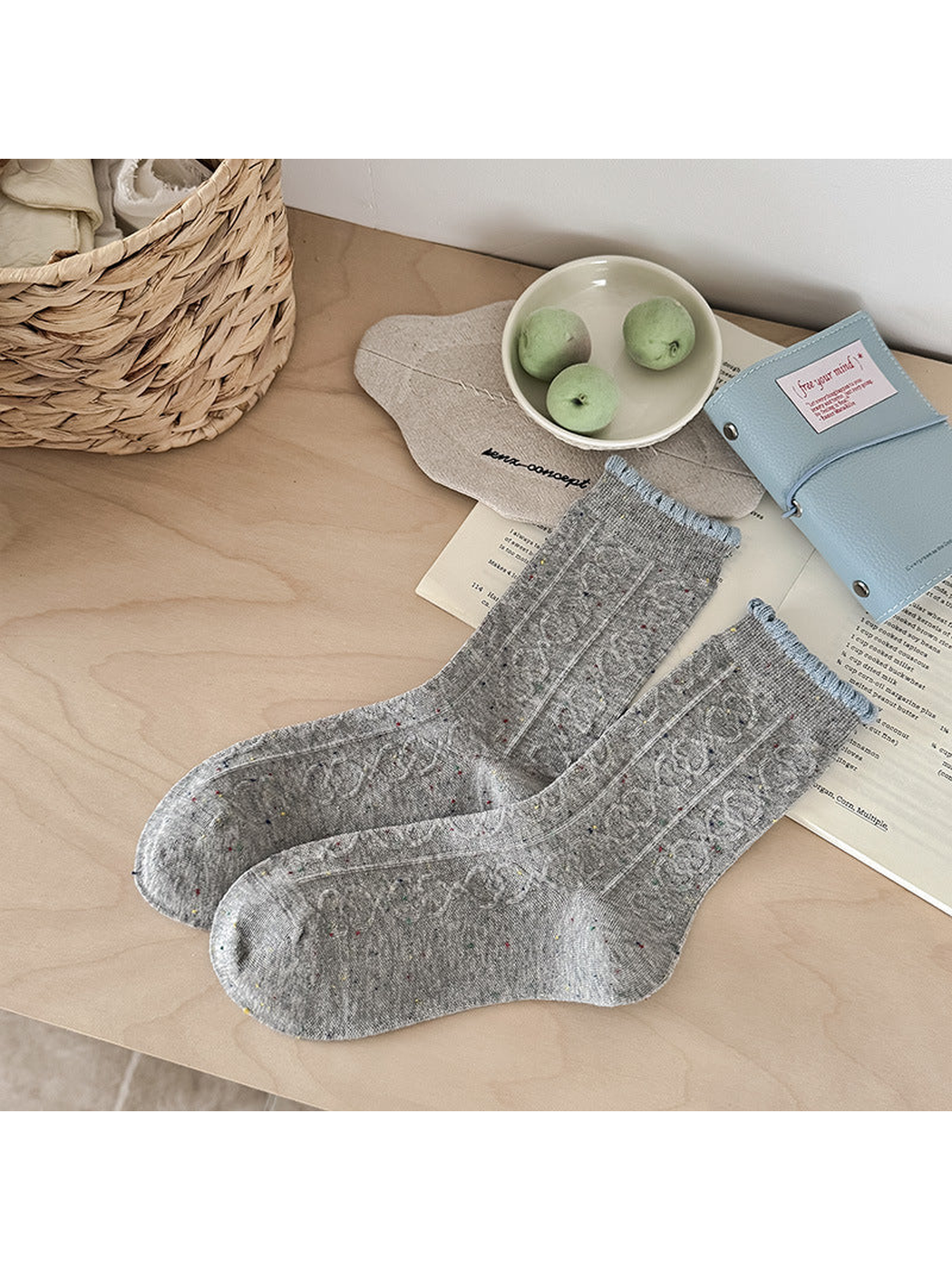 Gray flecked crew socks with raised cable pattern and light blue scalloped cuffs