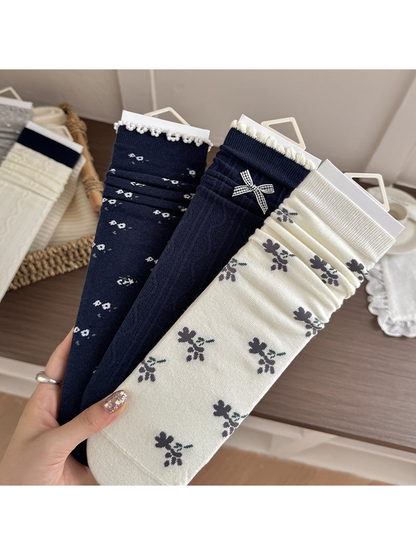 Navy Floral, Navy Bow and Ivory Floral socks displayed together