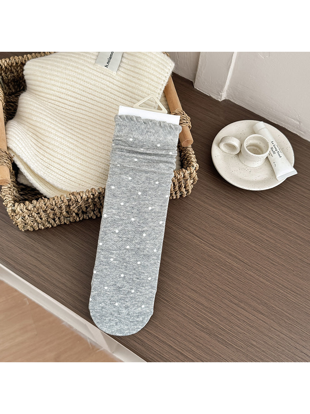 Gray Dots crew sock with white polka dots and a rolled edge