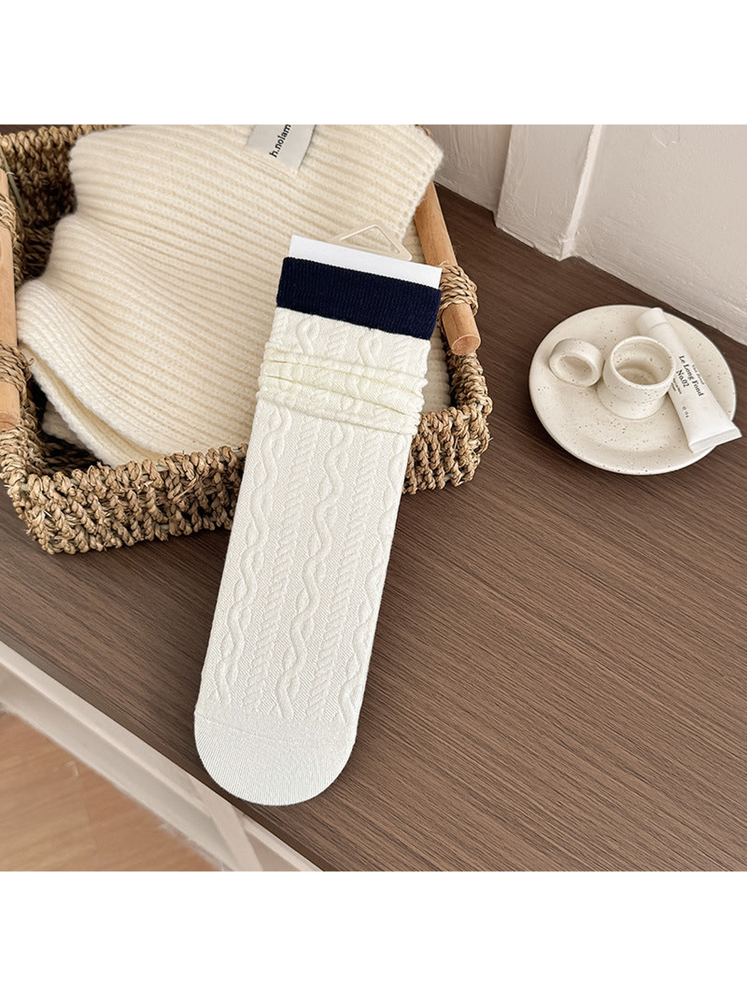 Contrast Cuff crew sock with an ivory cable-textured body and navy cuff