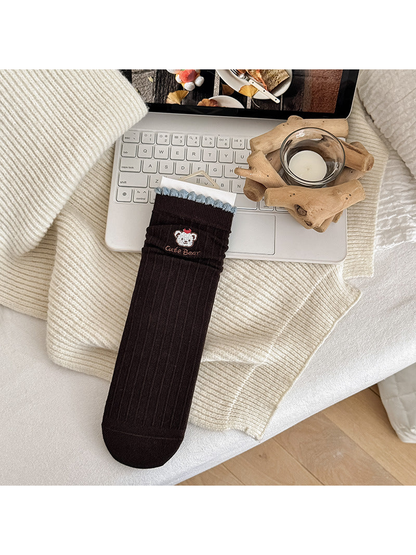 Letter Bear crew sock with ribbed brown body and blue ruffle trim