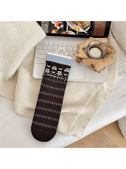 Heart Bear crew sock with brown geometric pattern and blue cuff