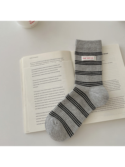 Gray crew sock with black horizontal stripes