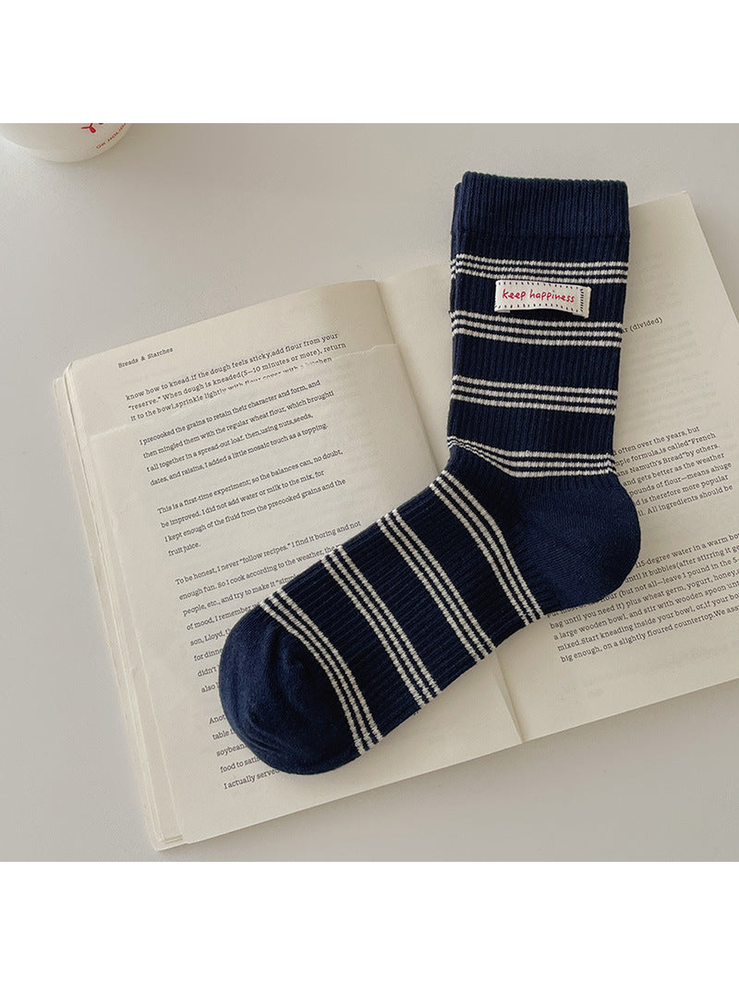 Navy crew sock with ivory horizontal stripes