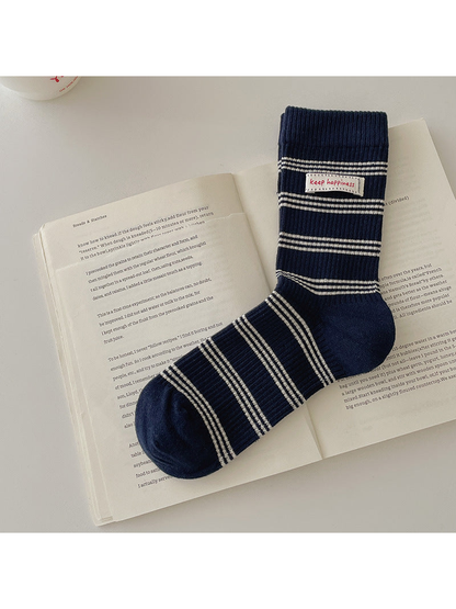Navy crew sock with ivory horizontal stripes