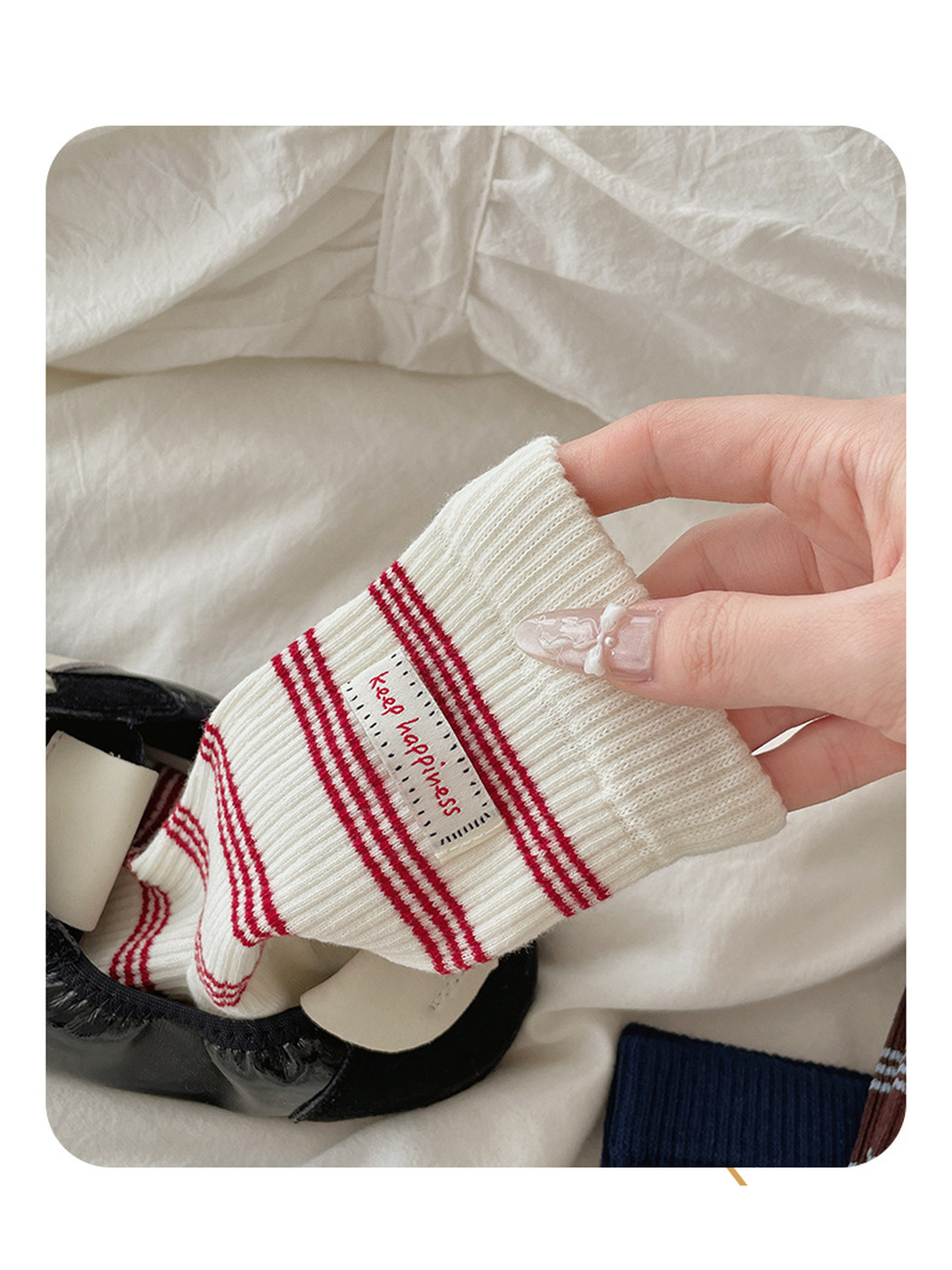 Close-up of the Ivory striped sock cuff and woven label