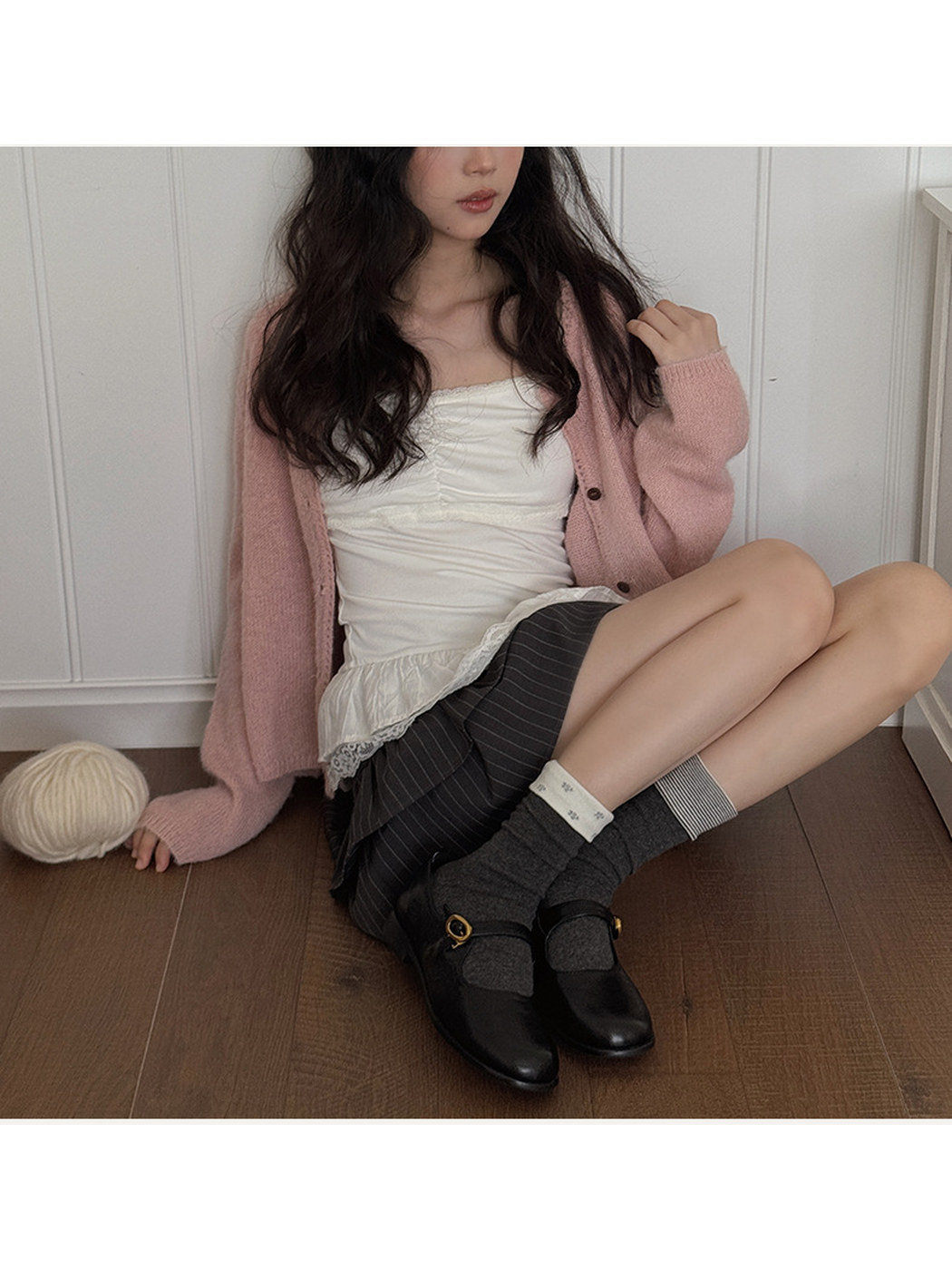 Model styling dark gray foldover crew socks with black flats