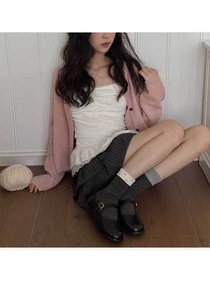 Model styling dark gray foldover crew socks with black flats