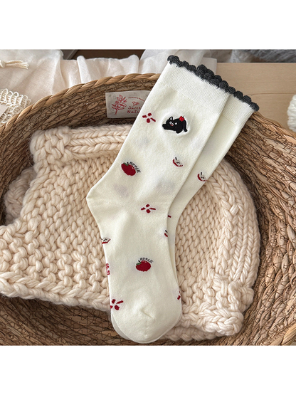 Apple Cat ivory crew socks with a dark scalloped cuff