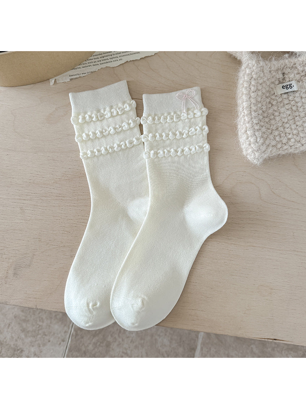 Bow ivory crew socks with looped cuff trim and embroidered bow