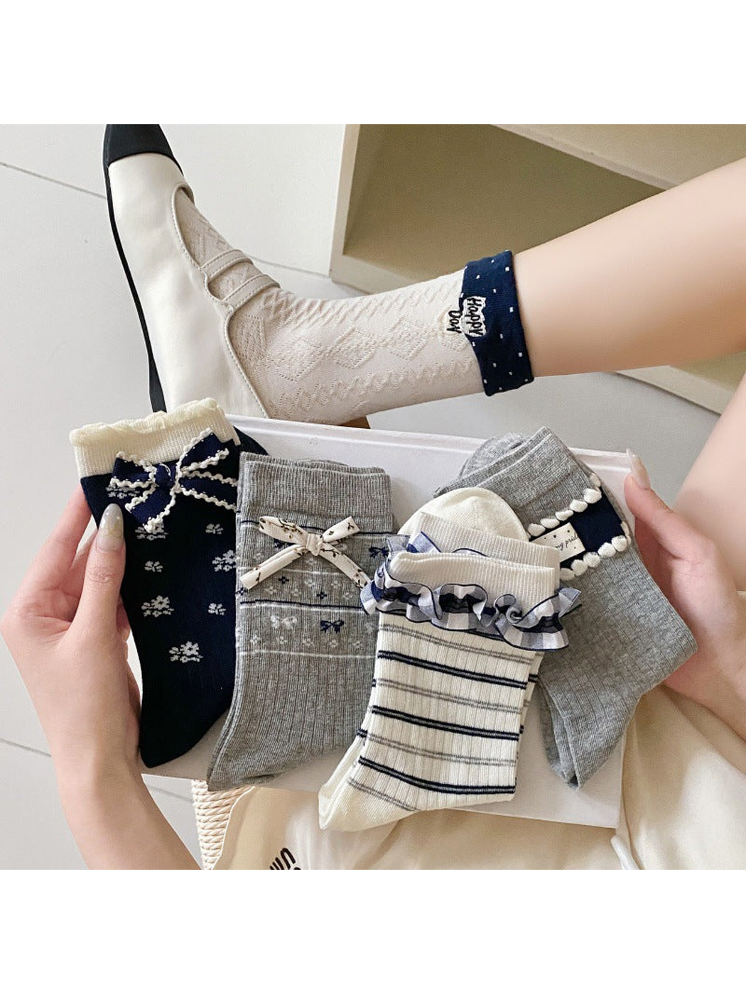 Geometric cuff socks worn with two-tone flats beside five decorative sock styles