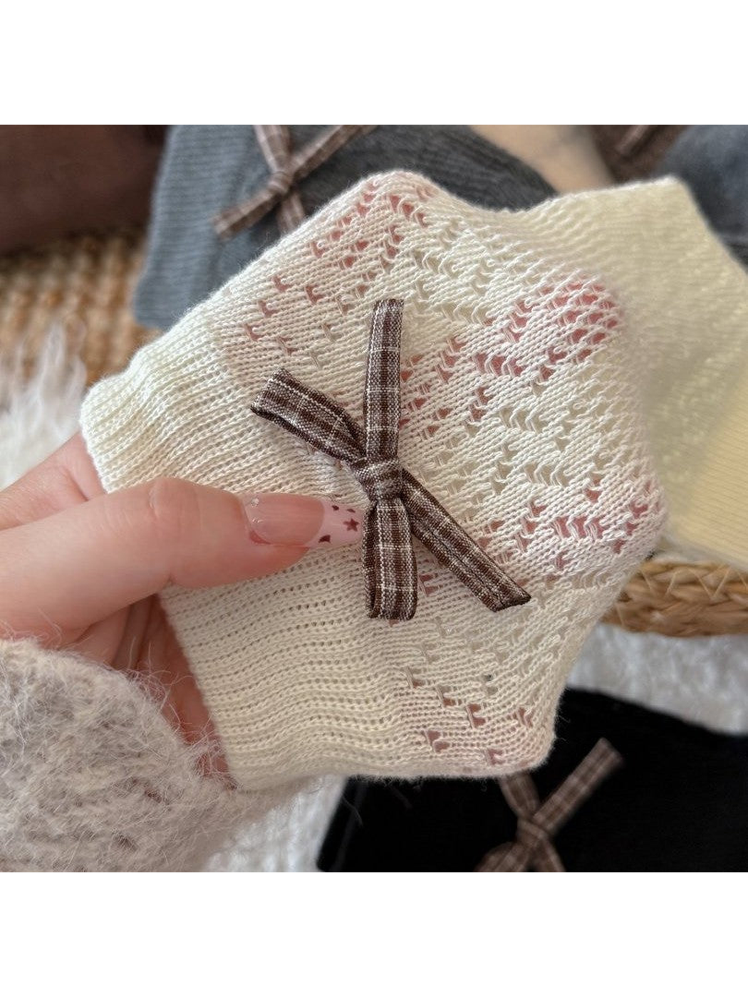 Close-up of the plaid bow and pointelle pattern