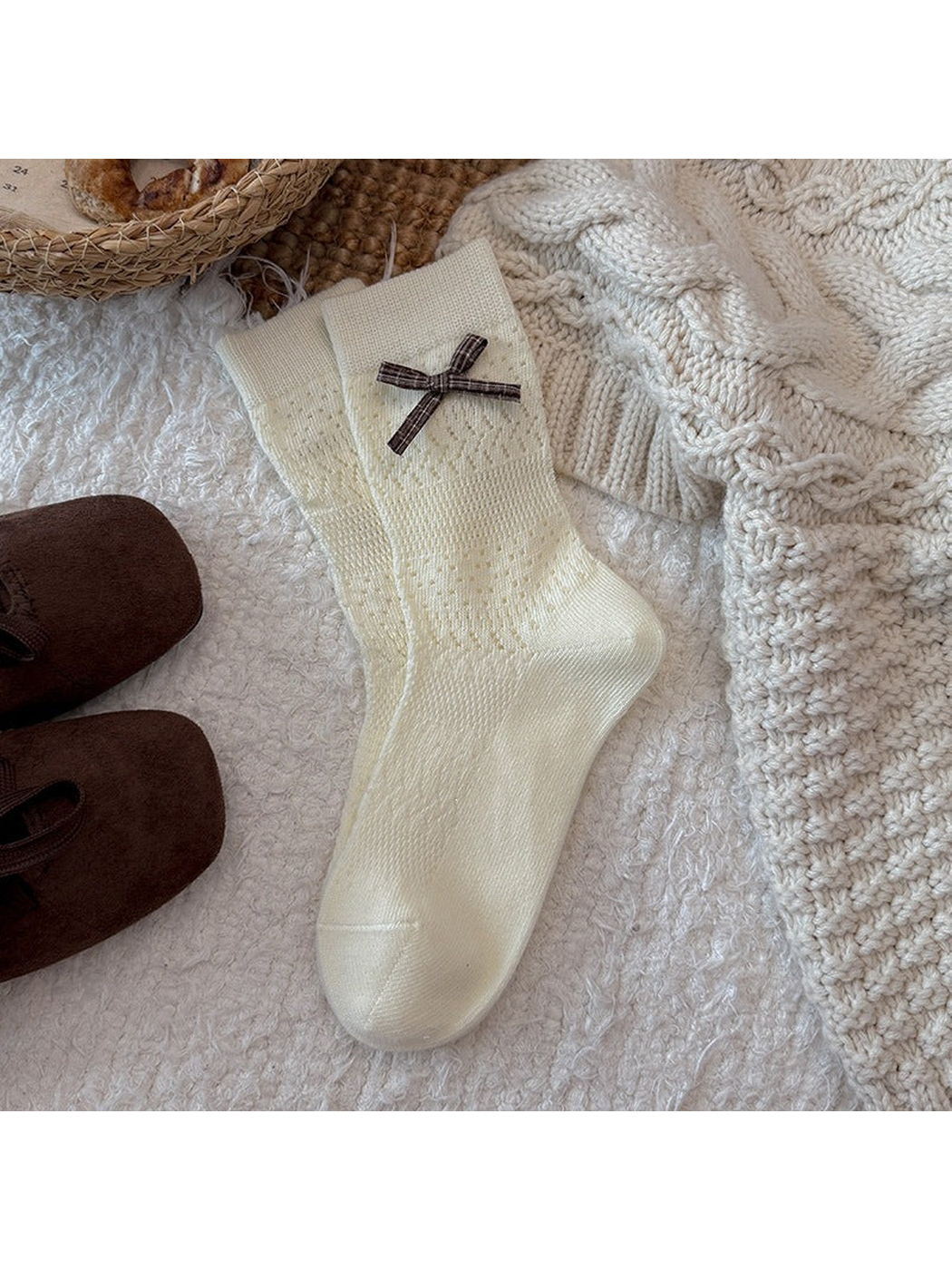 Ivory pointelle crew socks with a plaid bow