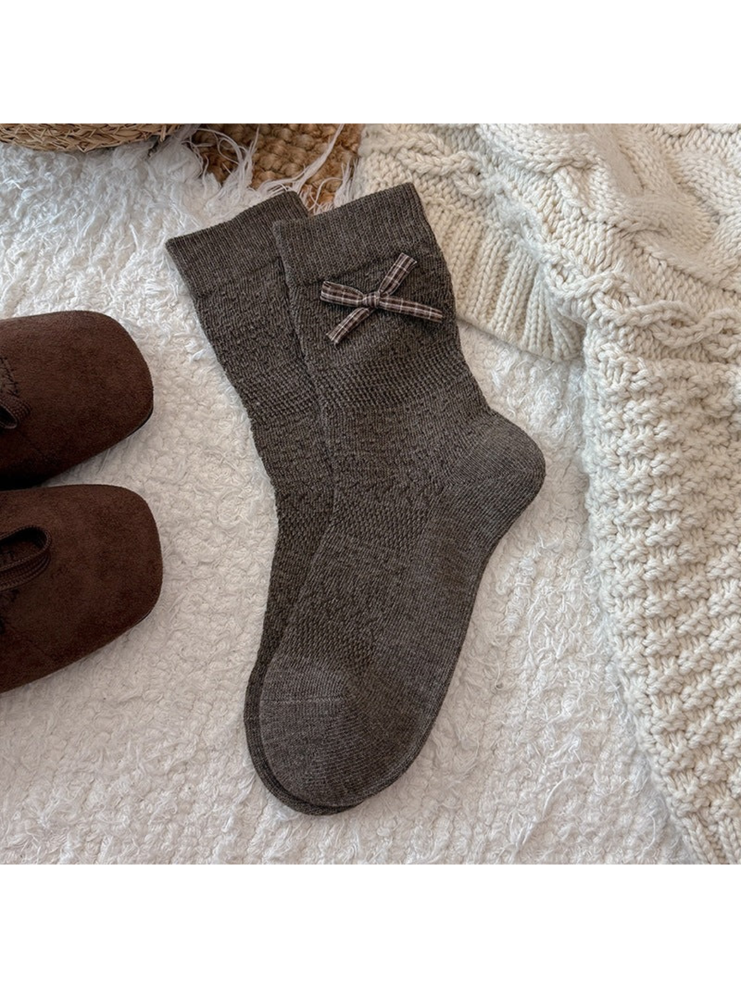 Brown crew socks with a plaid bow