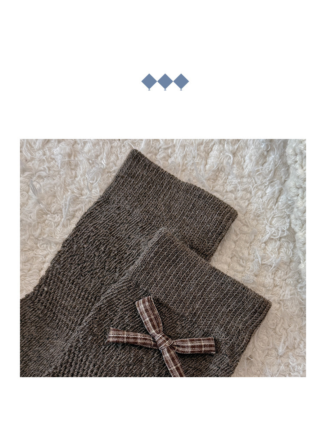 Close-up of the Brown sock cuff, knit texture and plaid bow