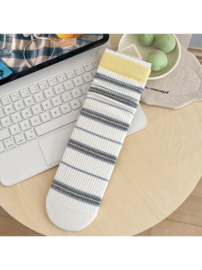 Yellow Cuff white socks with gray and blue stripes