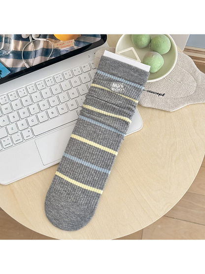 Lettered Stripes gray socks with blue and yellow stripes