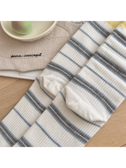 Close-up of heel shaping on white striped socks