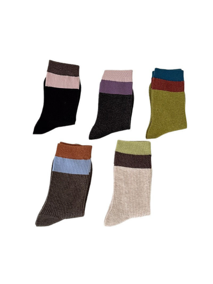 Five color-block ribbed crew sock styles displayed together on a white background