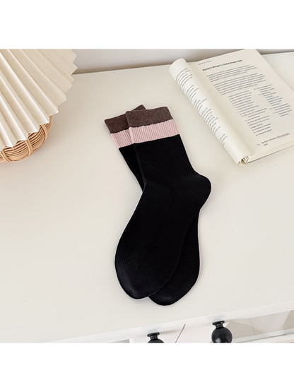Black ribbed crew socks with light pink and dark brown cuff bands