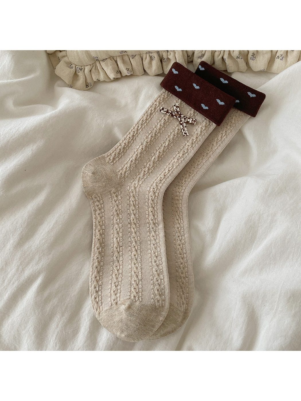 Beige Heart Bow crew socks with brown heart cuffs and a bow accent