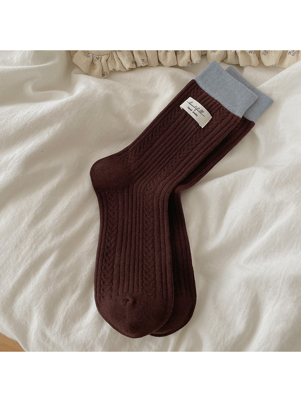Dark brown Fabric Label crew socks with a pale blue cuff