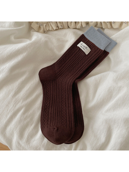 Dark brown Fabric Label crew socks with a pale blue cuff