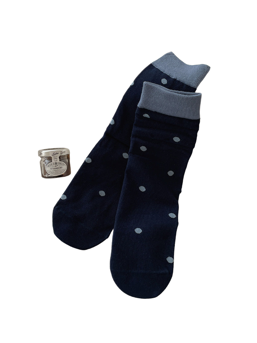 Navy crew socks with light blue polka dots and contrasting cuffs