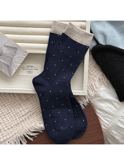 Navy ribbed crew socks with small polka dots and beige cuffs