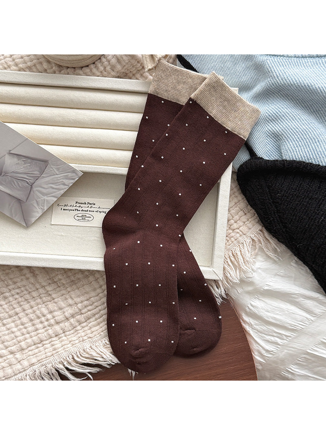 Coffee ribbed crew socks with small polka dots and beige cuffs