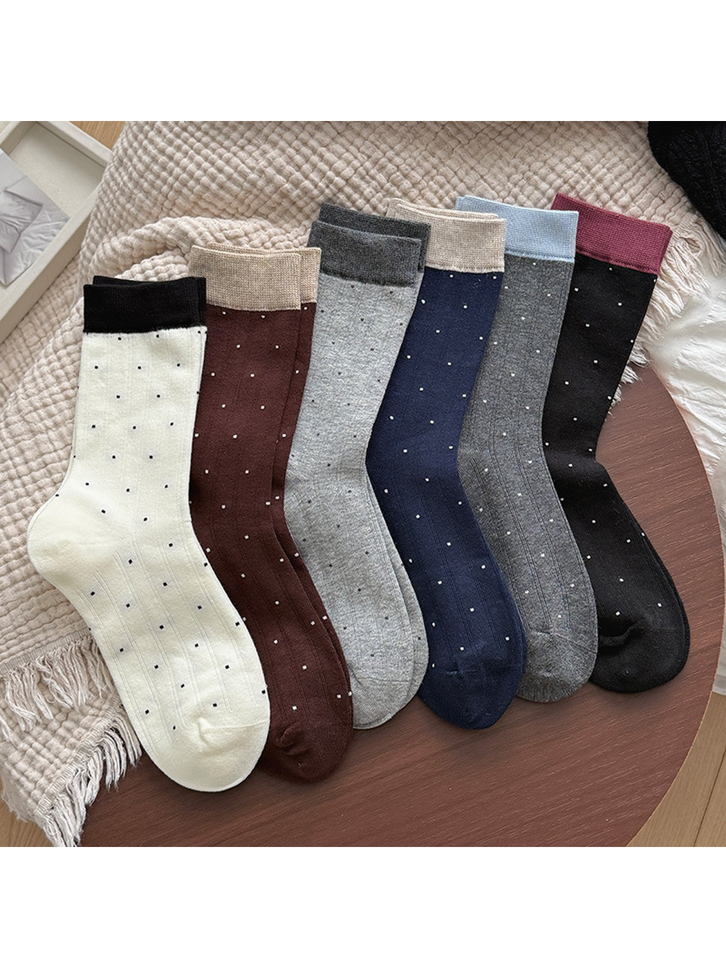 Six colors of ribbed polka-dot crew socks arranged on a tabletop