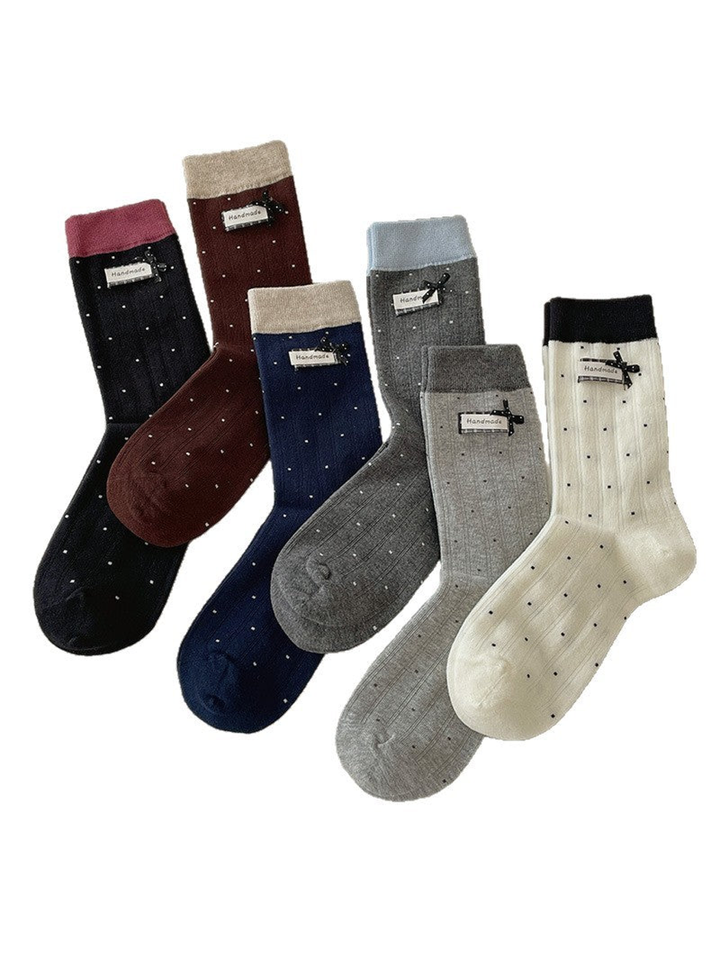 Six polka-dot crew sock colors with contrasting cuffs displayed together