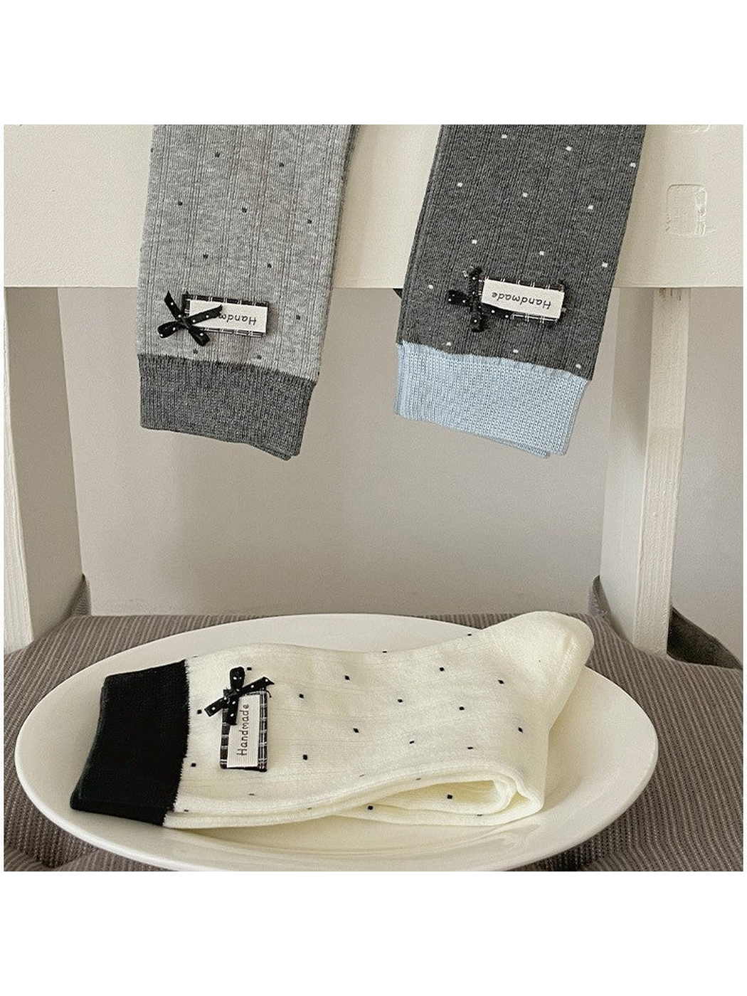 Light Gray, Dark Gray and Ivory polka-dot crew socks displayed together