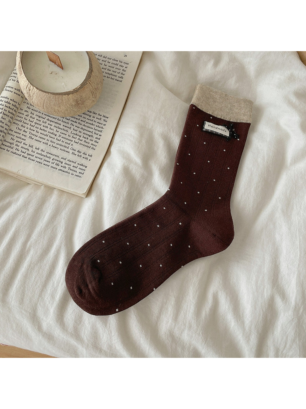 Brown polka-dot crew sock with contrasting cuff and bow accent