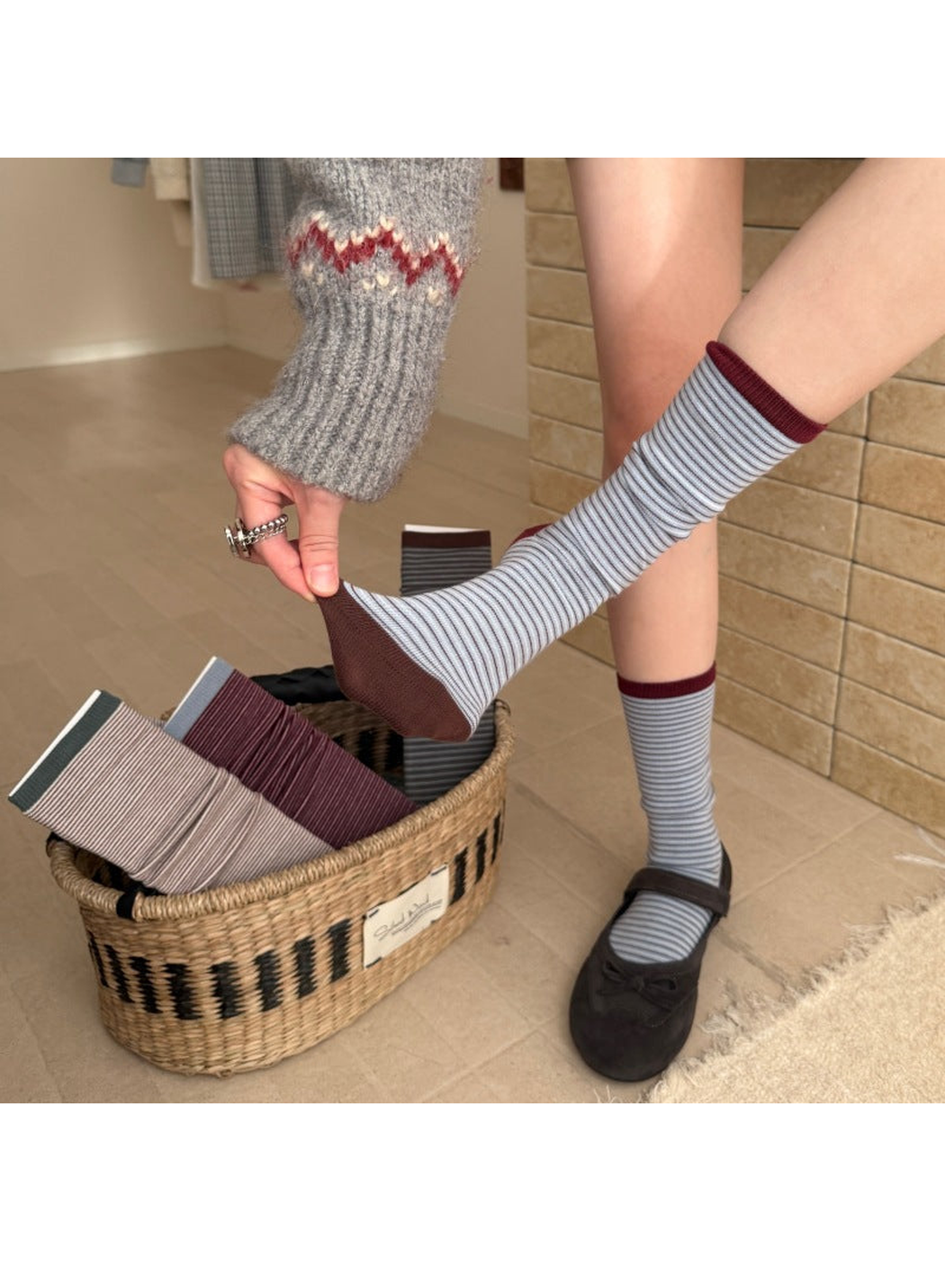 Light Blue striped crew socks worn with black Mary Jane shoes