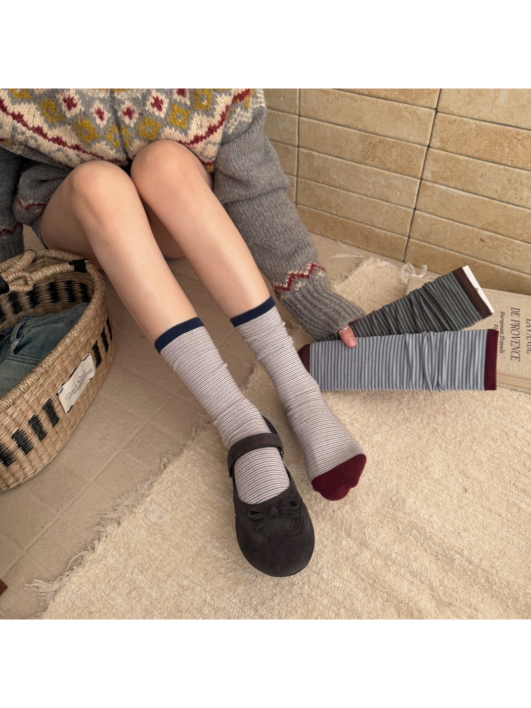 Black striped crew socks worn with black Mary Jane shoes