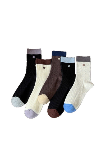 Five color-block ribbed crew sock styles displayed together