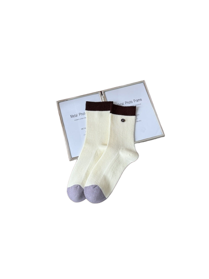 Cream ribbed crew socks with brown cuffs and lavender toes