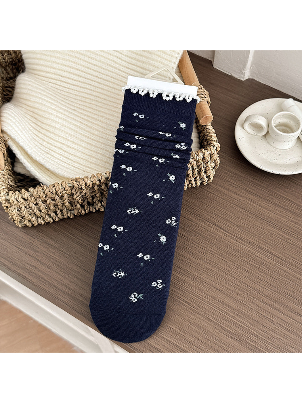 Ditsy Floral style navy crew sock with tiny white flowers