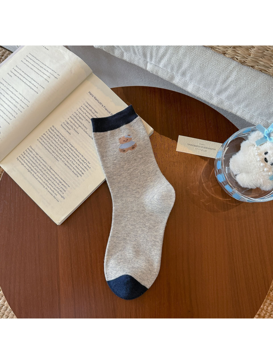 Seated Bear crew sock in gray with navy cuff and toe