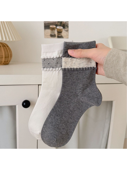 White and Dark Gray crew socks with contrasting dotted ankle bands